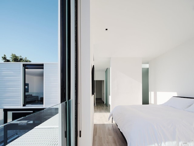 bedroom with wood finished floors