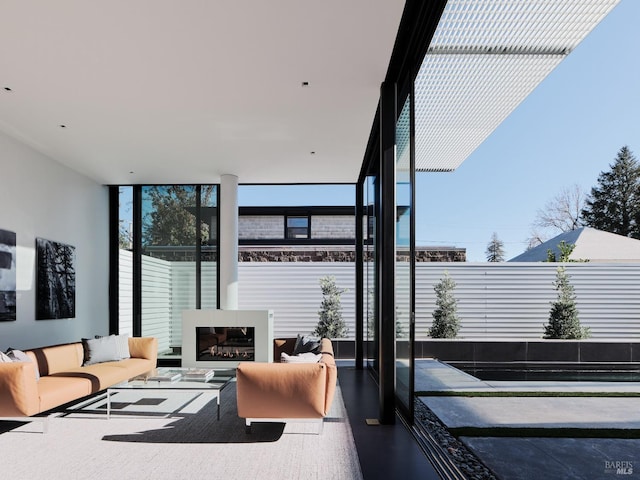 interior space featuring a wall of windows