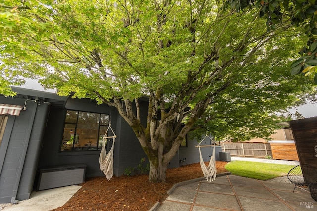 exterior space featuring fence and a patio area