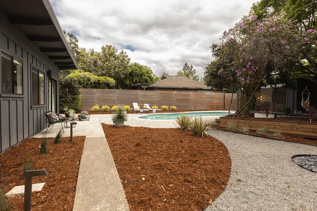 view of yard with a patio, a fenced backyard, and a fenced in pool