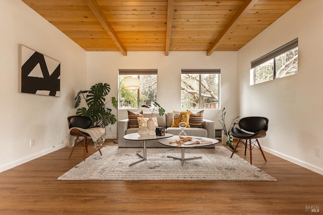 sitting room featuring plenty of natural light, wood ceiling, and baseboards