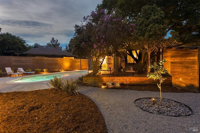 view of swimming pool with a fenced backyard, a fenced in pool, and a patio