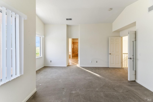 unfurnished bedroom with baseboards, visible vents, and carpet