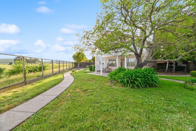 view of yard featuring a fenced backyard and a patio