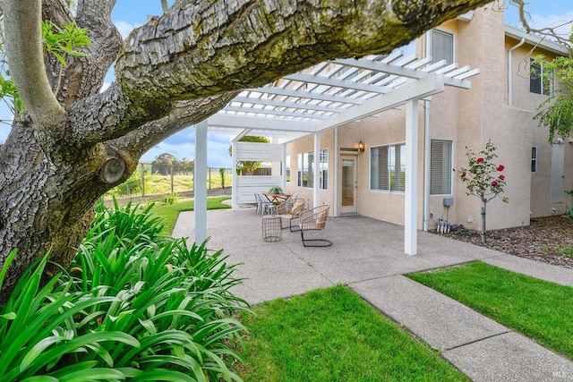 view of patio / terrace featuring a pergola and fence