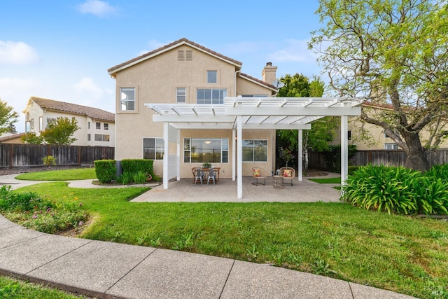 rear view of property featuring a patio area, a fenced backyard, a yard, a pergola, and stucco siding