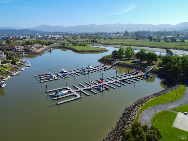 drone / aerial view with a water and mountain view
