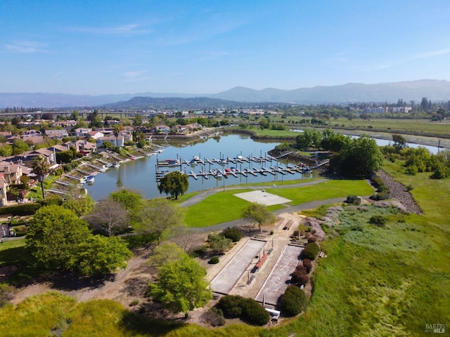 drone / aerial view with a water and mountain view