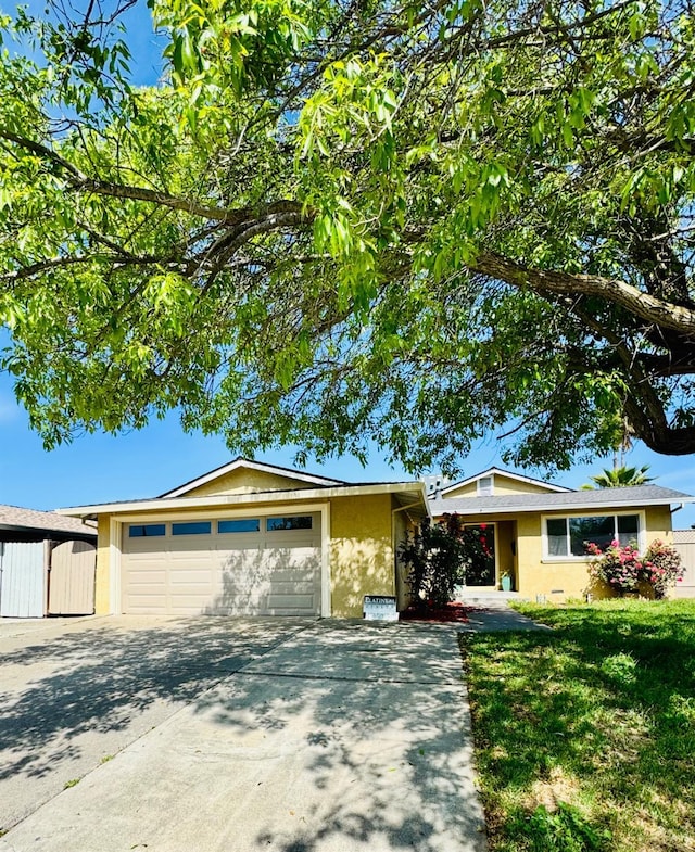 4647 Barbee Way, Sacramento, CA 95823 - single story home featuring stucco siding, a garage, concrete driveway, and a front yard