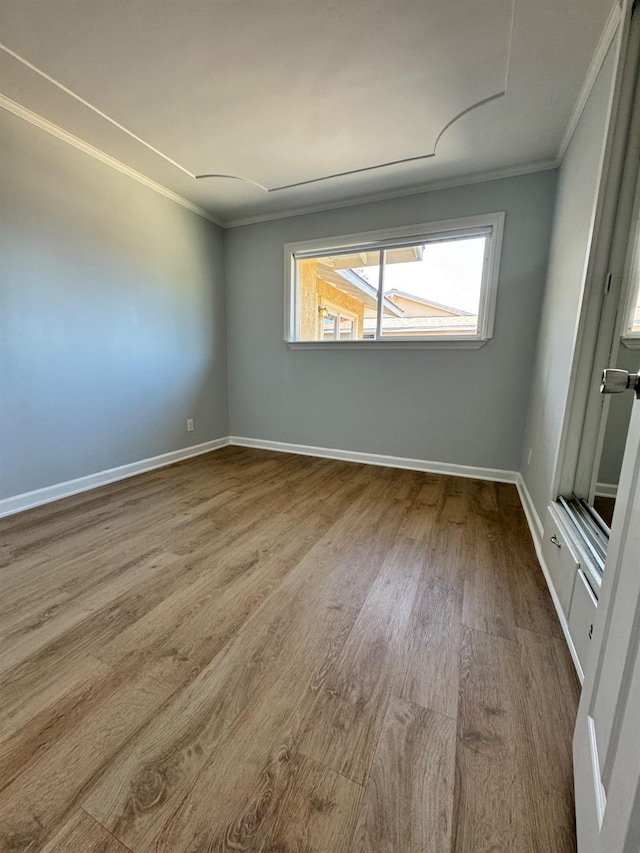 4647 Barbee Way, Sacramento, CA 95823 - unfurnished room with ornamental molding and wood finished floors