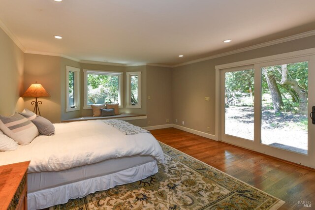 bedroom featuring recessed lighting, baseboards, wood finished floors, and access to exterior