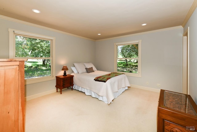 bedroom with baseboards, light colored carpet, and multiple windows