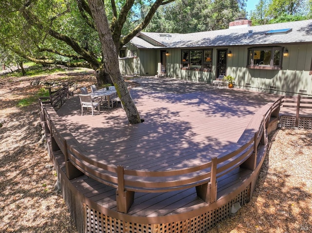 deck with outdoor dining area