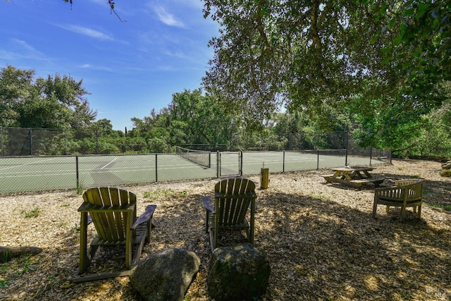 view of sport court with fence