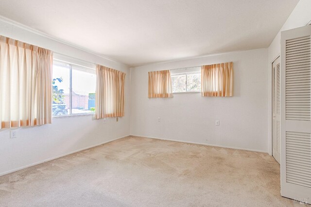 4 Valley Green St, Santa Rosa, CA 95409 - unfurnished bedroom featuring visible vents, a closet, baseboards, ensuite bathroom, and light colored carpet