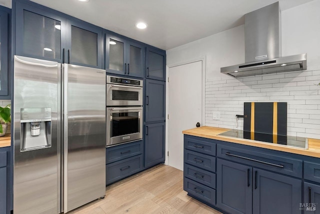 269 Castro St, Lagunitas, CA 94938 - kitchen with appliances with stainless steel finishes, range hood, decorative backsplash, and wood counters