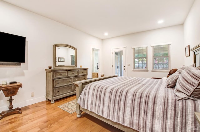 bedroom with recessed lighting, baseboards, and light wood-style floors