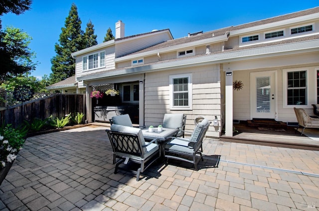 view of patio / terrace with fence and entry steps