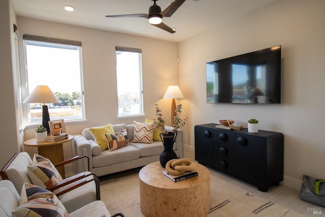 living room with baseboards, recessed lighting, and ceiling fan