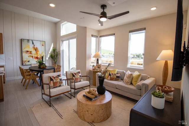 living area featuring a ceiling fan and recessed lighting