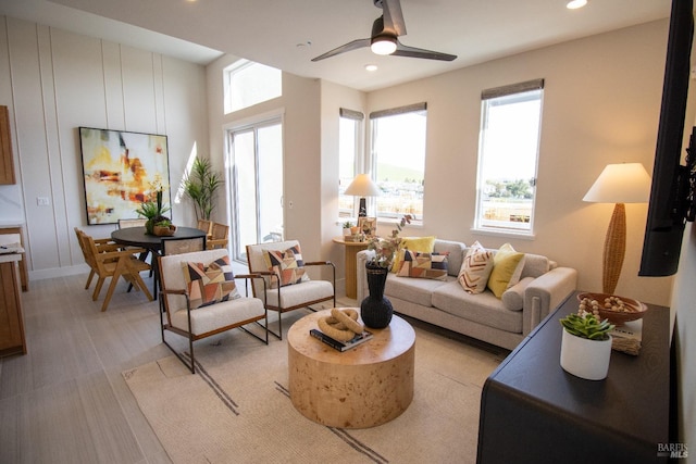 living room featuring recessed lighting and a ceiling fan