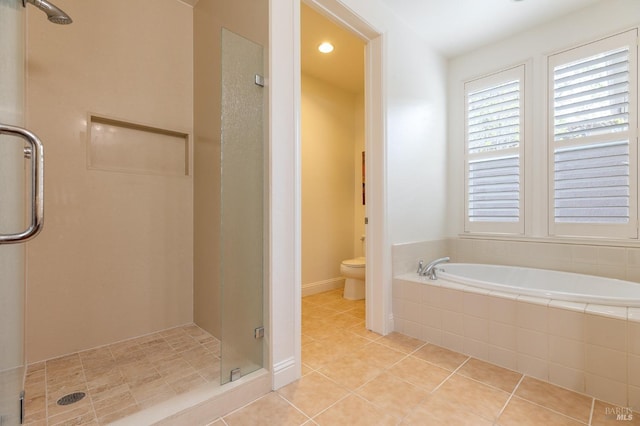bathroom featuring a garden tub, tile patterned flooring, toilet, recessed lighting, and a stall shower