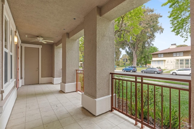 balcony featuring covered porch and ceiling fan