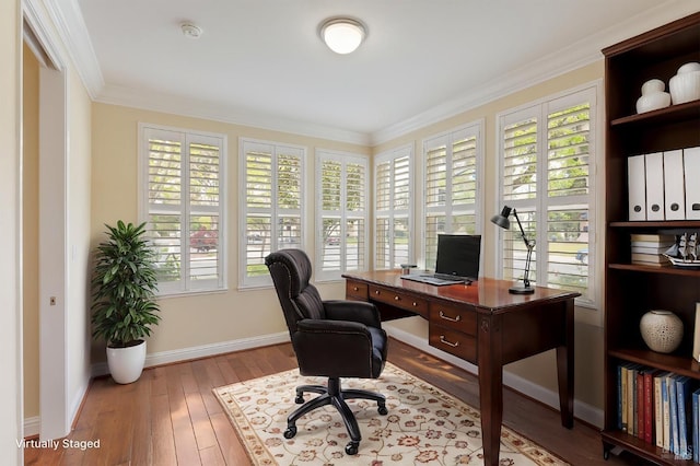 office area featuring crown molding, baseboards, and wood-type flooring