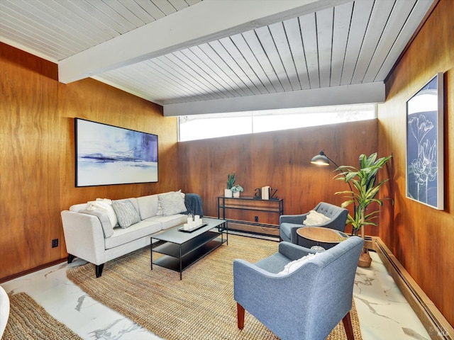 living area featuring baseboard heating, wood walls, beam ceiling, a baseboard radiator, and marble finish floor