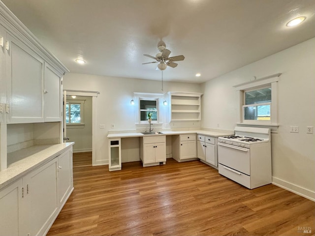 2984 First St, Napa, CA 94558 - kitchen with white gas range oven, a sink, a ceiling fan, open shelves, and light countertops