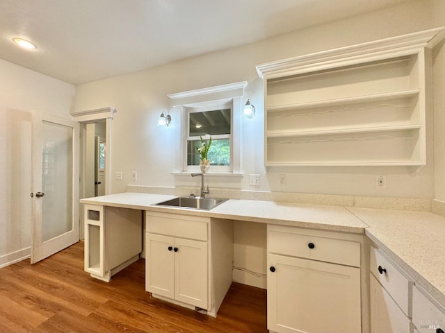 2984 First St, Napa, CA 94558 - kitchen with open shelves, a sink, wood finished floors, and white cabinetry
