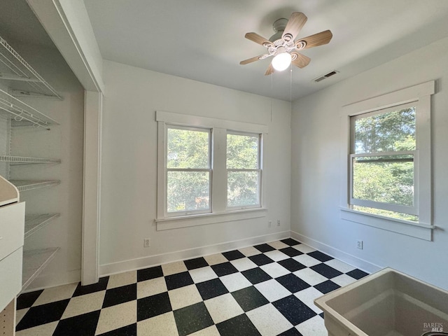 2984 First St, Napa, CA 94558 - unfurnished room featuring tile patterned floors, a ceiling fan, a sink, and baseboards
