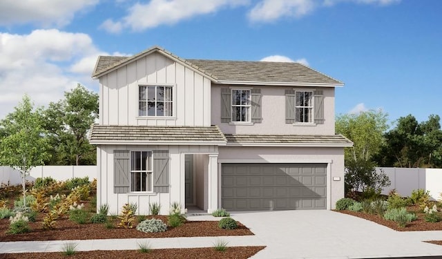 view of front of home with a garage, fence, board and batten siding, and concrete driveway