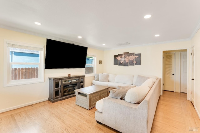 1034 Caldwell Ave, Vallejo, CA 94591 - living room featuring crown molding, baseboards, recessed lighting, and light wood-style flooring