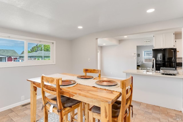 1034 Caldwell Ave, Vallejo, CA 94591 - dining area featuring recessed lighting, baseboards, stone finish floor, and visible vents