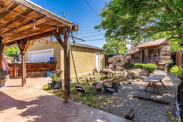 1034 Caldwell Ave, Vallejo, CA 94591 - view of yard featuring fence, an outbuilding, and a patio