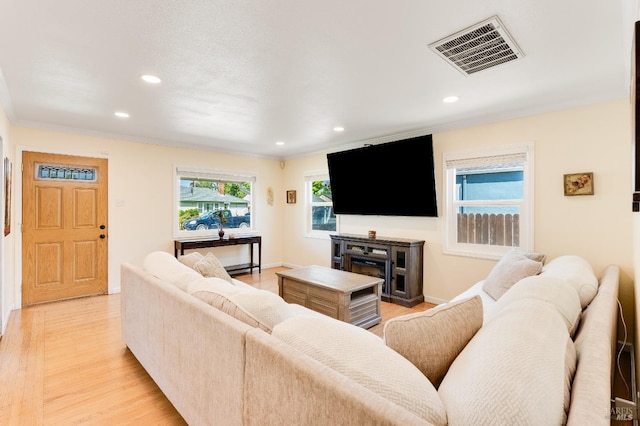 1034 Caldwell Ave, Vallejo, CA 94591 - living area with recessed lighting, light wood-style flooring, baseboards, and crown molding