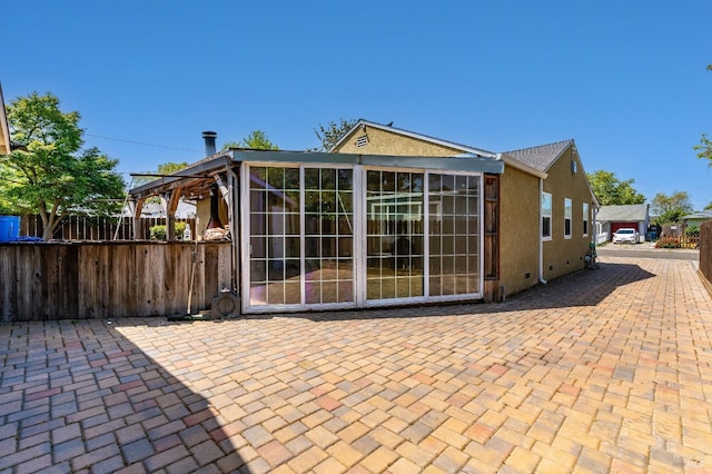 1034 Caldwell Ave, Vallejo, CA 94591 - back of property with fence, a patio area, and stucco siding