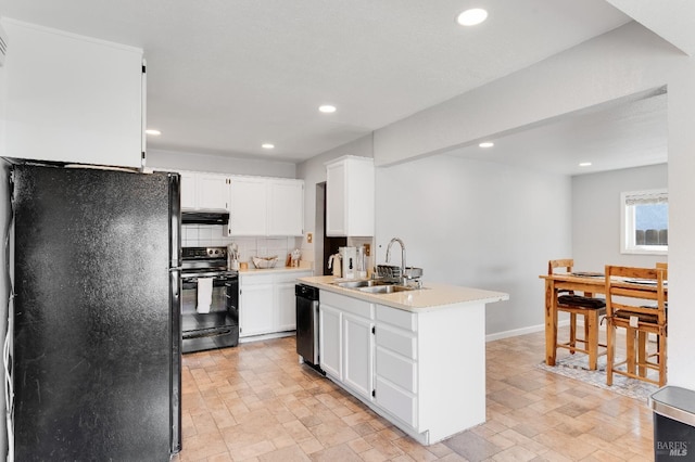 1034 Caldwell Ave, Vallejo, CA 94591 - kitchen with white cabinetry, under cabinet range hood, a sink, backsplash, and black appliances