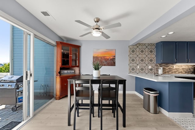 dining space with visible vents, light wood-style floors, baseboards, ceiling fan, and recessed lighting