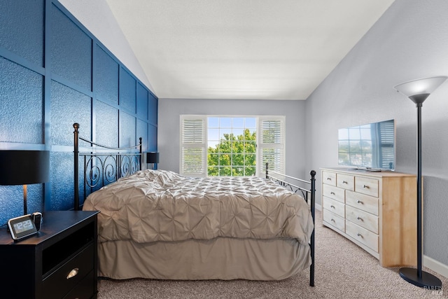 bedroom featuring light carpet