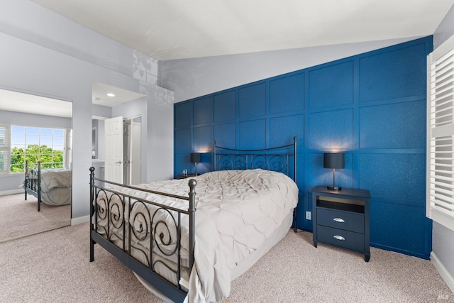 bedroom featuring light colored carpet