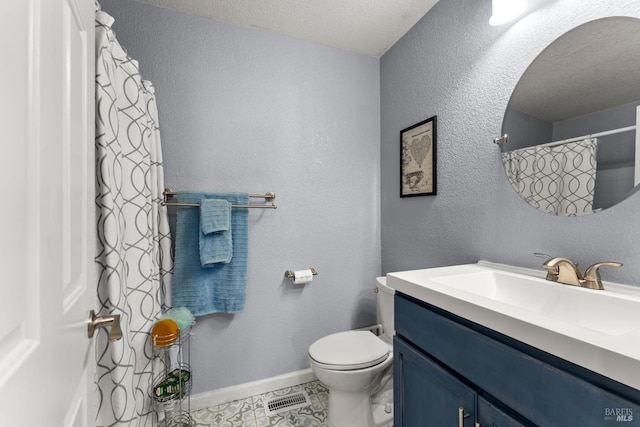 full bath with a textured ceiling, visible vents, vanity, baseboards, and toilet