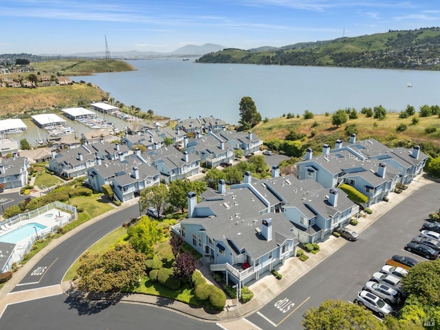 bird's eye view with a water view and a residential view