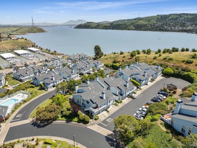 bird's eye view with a water view and a residential view