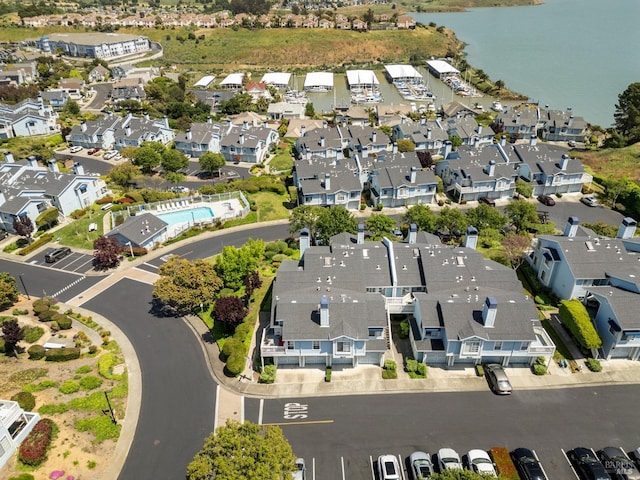 bird's eye view featuring a residential view and a water view