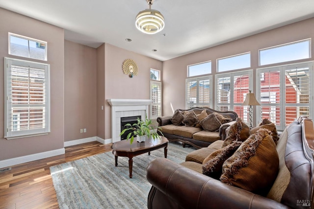 1216 Hermitage Way, Rohnert Park, CA 94928 - living room with baseboards, visible vents, a tiled fireplace, and wood finished floors