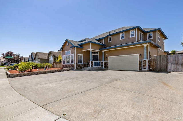 1216 Hermitage Way, Rohnert Park, CA 94928 - view of front of home featuring a garage, fence, driveway, and stone siding