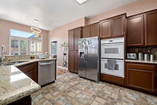 1216 Hermitage Way, Rohnert Park, CA 94928 - kitchen with decorative backsplash, hanging light fixtures, a sink, a notable chandelier, and stainless steel appliances