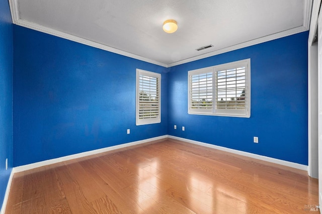 1216 Hermitage Way, Rohnert Park, CA 94928 - empty room with crown molding, baseboards, visible vents, and wood finished floors